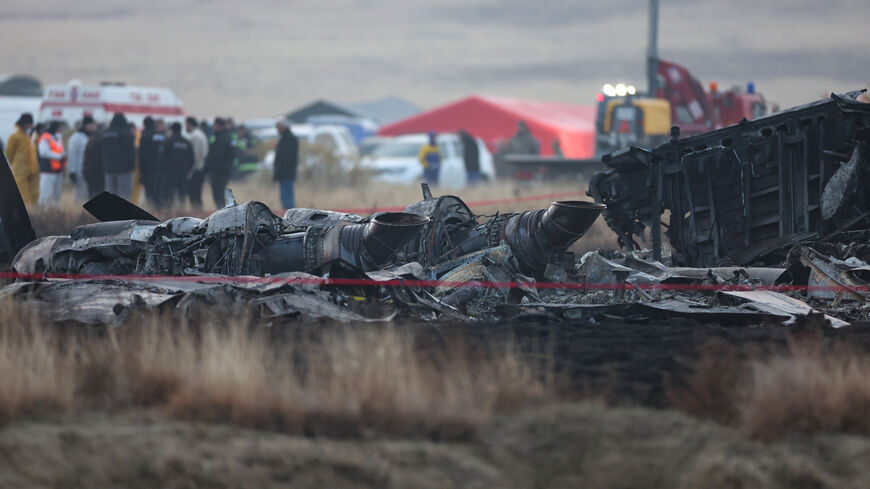 Wreckage is seen at the crash site of the Turkish C-130 military cargo plane in the Sighnaghi area at the Georgia-Azerbaijan border on November 12, 2025. A Turkish military cargo plane carrying 20 passengers and crew crashed in Georgia on its way home from Azerbaijan, the defence ministry said Tuesday. (Photo by Giorgi ARJEVANIDZE / AFP) (Photo by GIORGI ARJEVANIDZE/AFP via Getty Images)