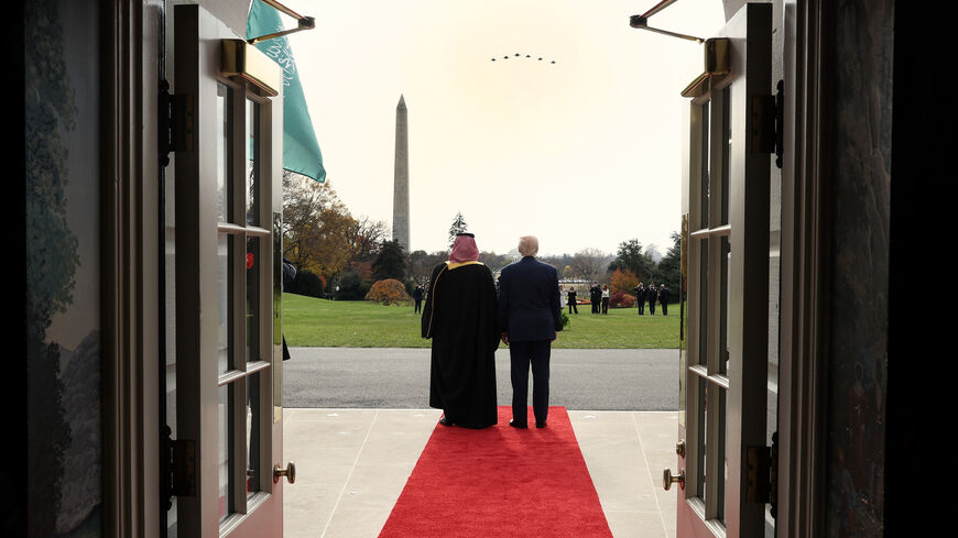 WASHINGTON, DC - NOVEMBER 18: Crown Prince and Prime Minister Mohammed bin Salman of Saudi Arabia (L) and U.S. President Donald Trump watch a military flyover as bin Salman arrives at the White House on November 18, 2025 in Washington, DC. Trump is hosting the crown prince for meetings aimed at strengthening economic and defense ties, including the U.S. sale of F-35 fighter jets to Saudi Arabia. (Photo by Win McNamee/Getty Images)