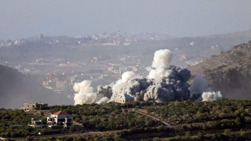 Smoke rises from the site of an Israeli airstrike that targeted the southern Lebanese village of El Mahmoudiyeh on November 27, 2025. The Israeli military said it had carried out a series of strikes against Hezbollah in southern Lebanon on November 27, the latest despite the year-old ceasefire with the militant group. (Photo by Rabih DAHER / AFP via Getty Images)