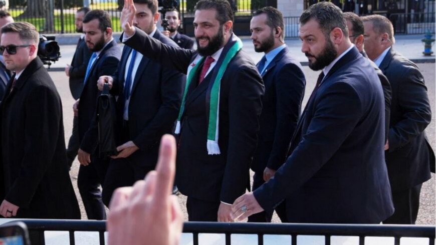 Syria's president, Ahmed al-Sharaa, greets supporters outside the White House on Nov. 10, 2025.