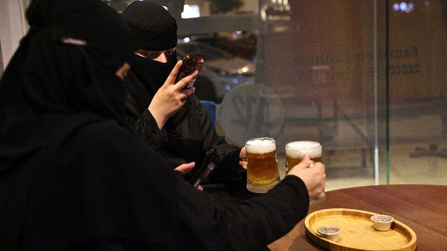 Saudi women enjoy alcohol-free draft beer at the A12 cafe in Riyadh