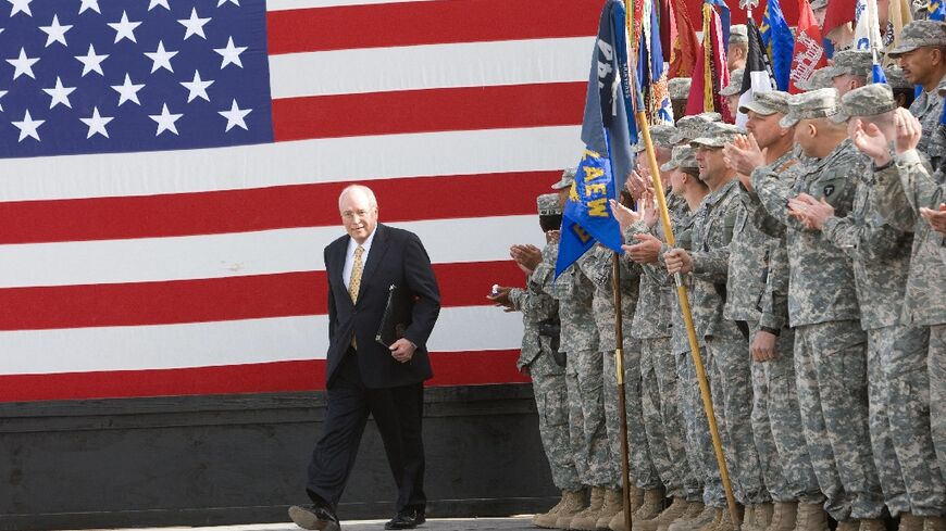 US Vice President Dick Cheney takes to the stage on March 18, 2008 to deliver remarks to US troops stationed at Balad Air Base, Iraq
