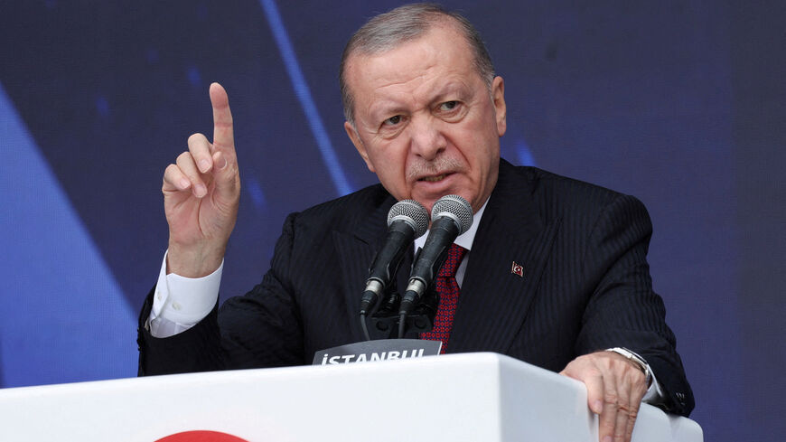 FILE PHOTO: Turkish President Tayyip Erdogan speaks during a ceremony for the handover of new vehicles to the gendarmerie and police forces in Istanbul, Turkey, November 28, 2025. REUTERS/Murad Sezer/File Photo