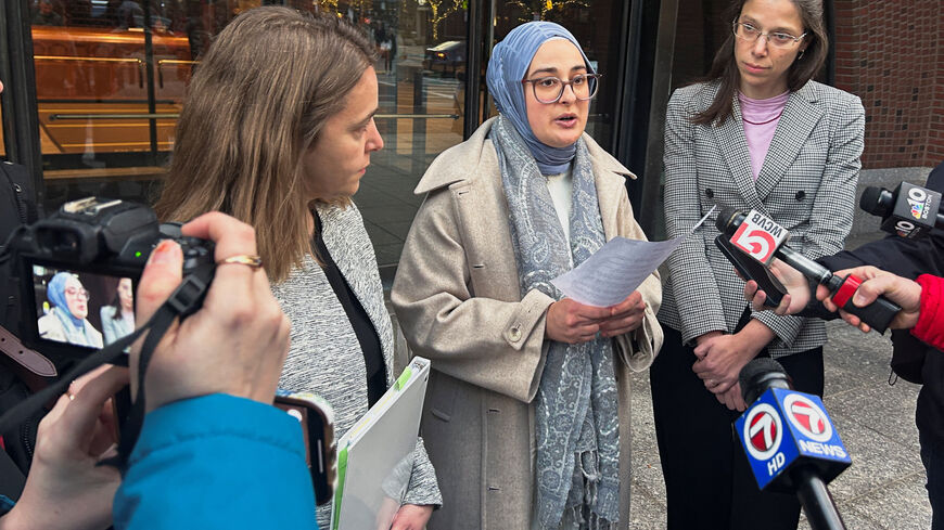 Rumeysa Ozturk, a Tufts University student from Turkey, speaks to reporters after urging a federal judge to order the Trump administration to restore her student visa record, outside the federal court in Boston, Massachusetts, U.S., December 4, 2025. REUTERS/Nate Raymond
