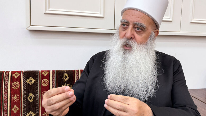 Leader of the Druze community in Israel, Sheikh Mowafaq Tarif, speaks with Reuters at his house in Julis, northern Israel July 28, 2025. REUTERS/Ali Sawafta