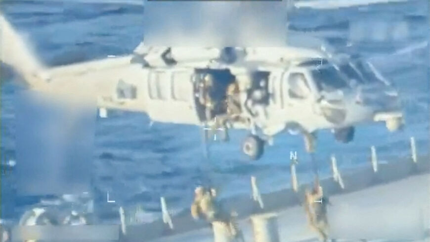 U.S. forces abseil onto an oil tanker during a raid described by U.S. Attorney General Pam Bondi as its seizure by the United States off the coast of Venezuela, December 10, 2025, in a still image from video.  U.S. Attorney General/Handout via REUTERS
