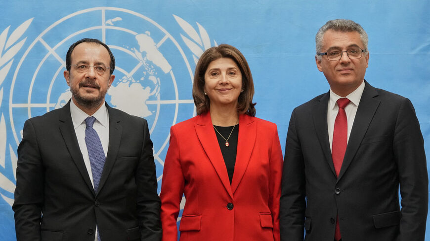 Republic of Cyprus President Nikos Christodoulides, United Nations Secretary-General's Personal Envoy on Cyprus, Maria Angela Holguin Cuellar, and  Turkish Cypriot leader Tufan Erhurman pose for a photograph  at the U.N. compound inside the UN buffer zone, in Nicosia, Cyprus, December 11, 2025. Petros Karadjias/Pool via REUTERS