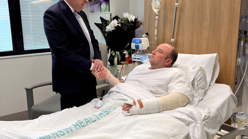 Australia's Prime Minister Anthony Albanese visits Ahmed al Ahmed, the bystander who charged at one of the gunmen and seized his rifle during the deadly shooting at Bondi Beach, at St George Hospital in Sydney, Australia. Prime Minister's Office/Handout via REUTERS