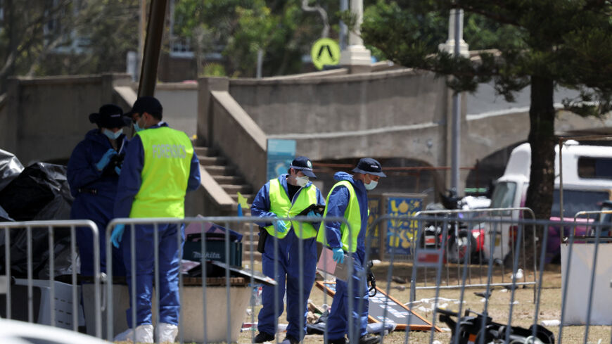 Members of the forensic team work at the scene of a shooting during a Jewish holiday celebration at Bondi Beach, in Sydney, Australia, December 15, 2025. REUTERS/Hollie Adams