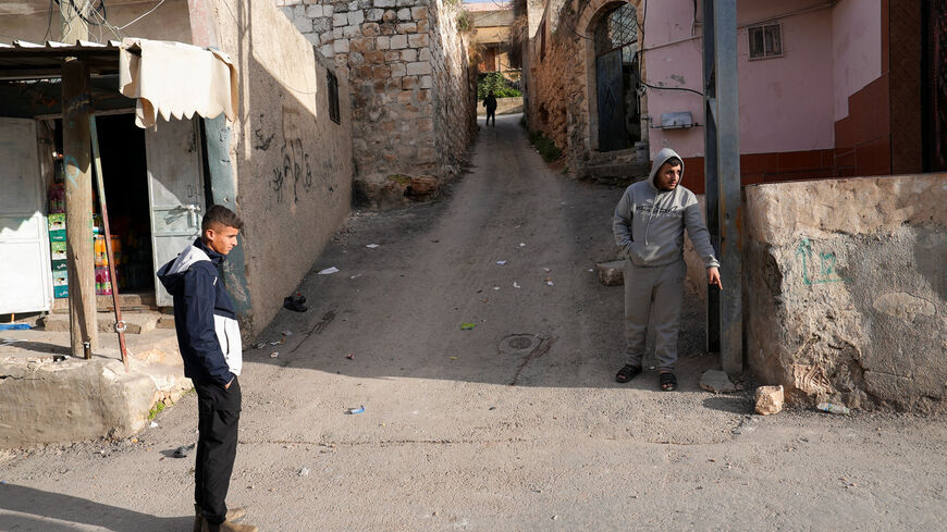 Eyewitness Kamel Zakarneh points where 16-year old Palestinian Rayyan Abu Mualla was killed by Israeli forces during a raid, in Qabatiya in the Israeli-occupied West Bank, December 21,2025. REUTERS/Ali Sawafta