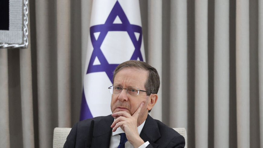 Israeli President Isaac Herzog looks on during a meeting with German Chancellor Friedrich Merz at the President's residence in Jerusalem, December 6, 2025.    Abir Sultan/Pool via REUTERS
