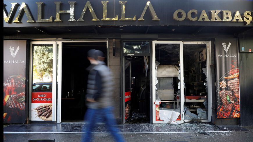 FILE PHOTO: A man looks as he walks past a demolished Turkish owned restaurant in downtown, after a man was stabbed and wounded in a late-night incident in Podgorica, Montenegro, October 27, 2025. REUTERS/Stevo Vasiljevic/File Photo