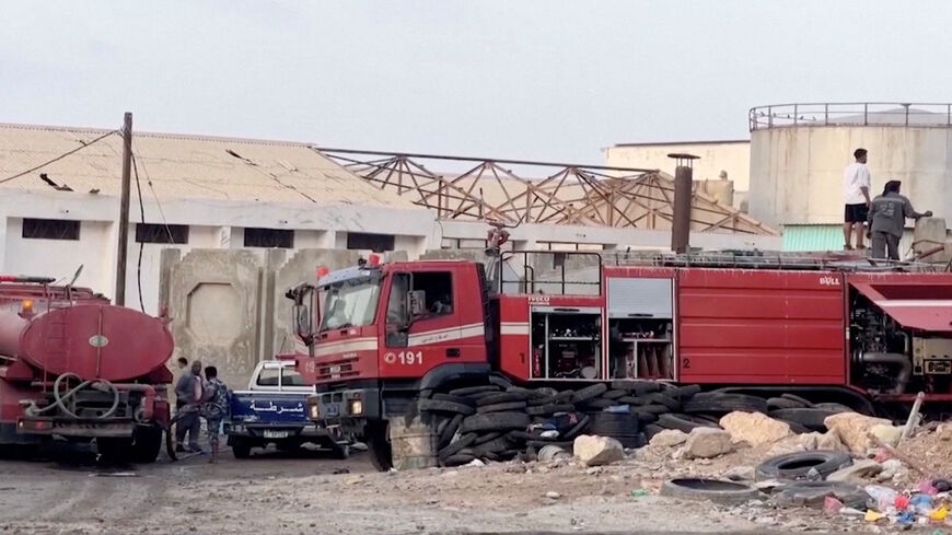 Emergency responders work on the site of a Saudi-led coalition airstrike, which targeted what it described as foreign military support to UAE-backed southern separatists, in Yemen's southern port of Mukalla, in this screengrab from a handout video obtained by Reuters on December 30, 2025.     Aden al-Mustakillah TV/Handout via REUTERS
