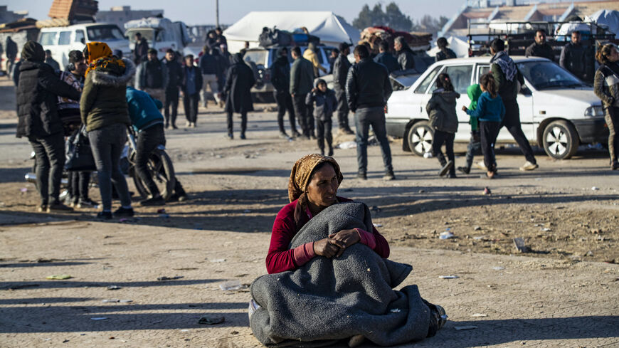 Syrian Kurds, fleeing from north of Aleppo, arrive in Tabqa, on the western outskirts of Raqa, on Dec. 4, 2024. 