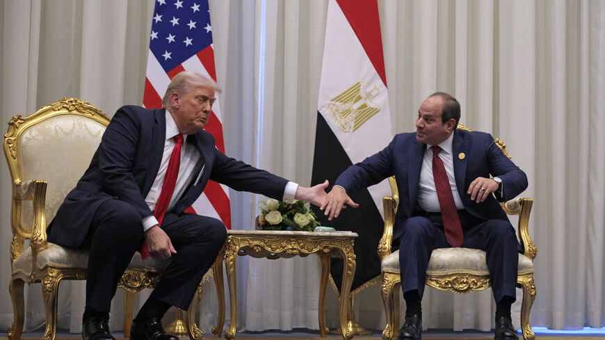 SHARM EL-SHEIKH, EGYPT - OCTOBER 13: U.S. President Donald Trump and President of Egypt Abdel Fattah El-Sisi clasp hands as they speak to the press before their meeting on October 13, 2025 in Sharm El-Sheikh, Egypt. President Trump is in Egypt to meet with European and Middle Eastern leaders in what’s being billed as an international peace summit, following the start of a US-brokered ceasefire deal to end the war in the Gaza Strip. (Photo by Chip Somodevilla/Getty Images)