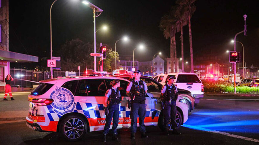 DECEMBER 14: Police enforce a cordon at Bondi Beach after a mass shooting on December 14, 2025 in Sydney, Australia. Two gunmen dressed in black fired several shots at Sydney's world-famous Bondi Beach, causing at least 10 fatalities and several more casualties, as New South Wales police said the toll was very likely to climb. (Photo by George Chan/Getty Images)