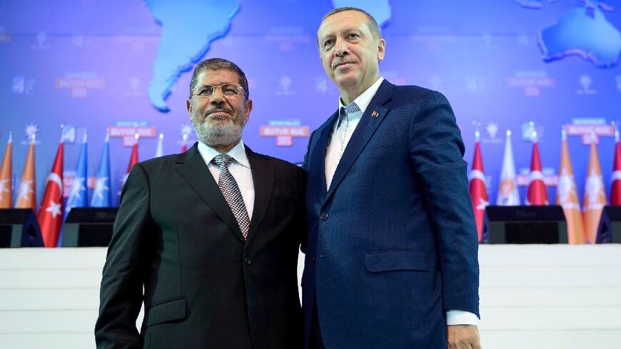 Turkey's leader Recep Tayyip Erdogan meets Egypt's then-president Mohamed Morsi, who rose to power democratically from the Muslim Brotherhood, in 2012 in Ankara