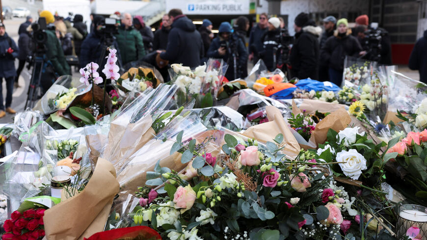 Floral tributes lie outside the "Le Constellation" bar, after a fire and explosion during a New Year's Eve party where people died and others were injured, in the upscale ski resort of Crans-Montana in southwestern Switzerland, January 2, 2026. REUTERS/Stephanie Lecocq