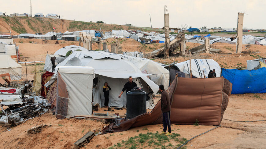 Displaced Palestinians take shelter in a tent camp, amid cold weather, in Khan Younis, southern Gaza Strip, December 28, 2025. REUTERS/Haseeb Alwazeer