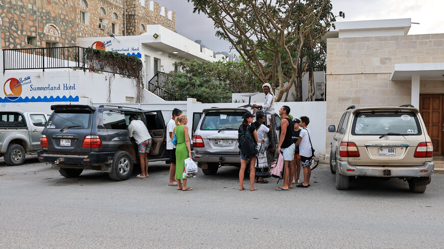 Tourists stand outside a hotel in the Socotra Island, Yemen, January 5, 2026. REUTERS/Stringer