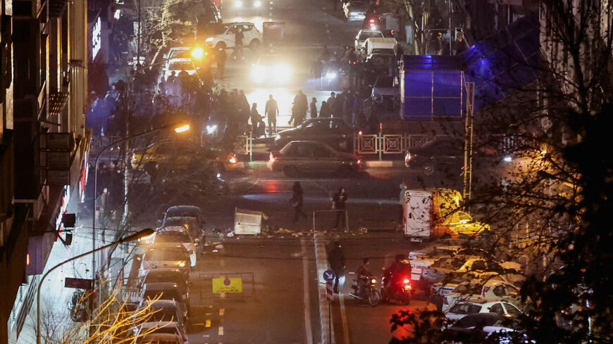 Iranian demonstrators gather in a street during a protest over the collapse of the currency's value, in Tehran, Iran, January 8, 2026. Stringer/WANA (West Asia News Agency) via REUTERS