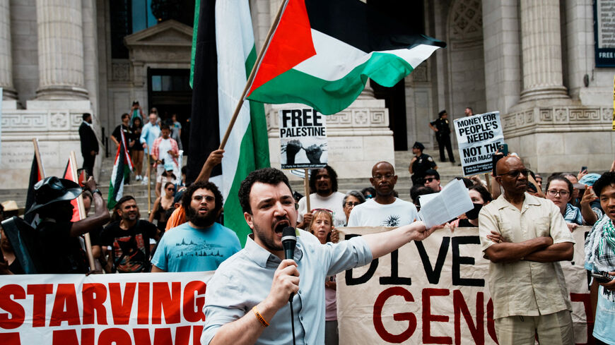 Mahmoud Khalil speaks to people as they gather at Bryant Park, to participate in a "Stop starving Gaza" march during the ongoing conflict between Israel and Hamas, in New York City, U.S., August 16, 2025. REUTERS/Eduardo Munoz