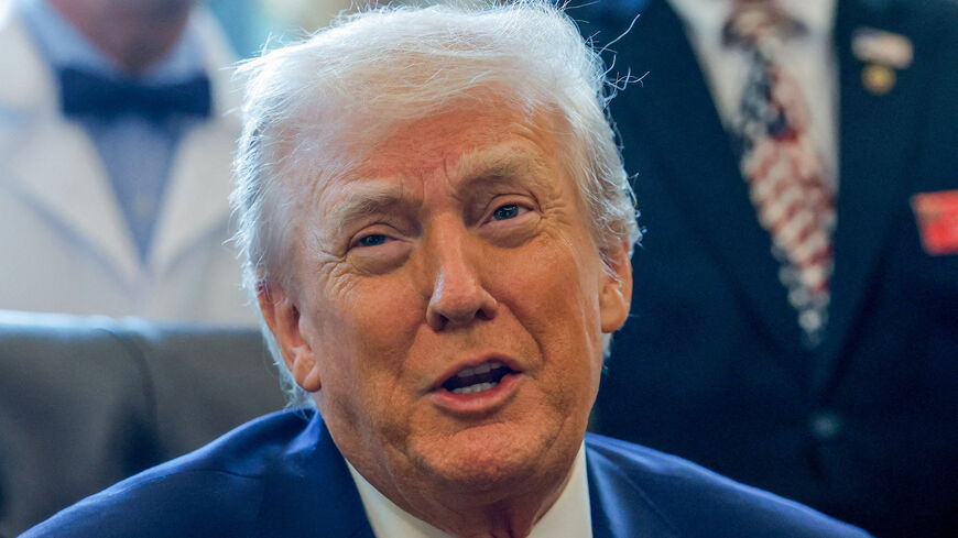 U.S. President Donald Trump speaks, as he signs an executive order recommending loosening the federal regulations on marijuana, in the Oval Office at the White House in Washington, D.C., U.S., December 18, 2025. REUTERS/Evelyn Hockstein