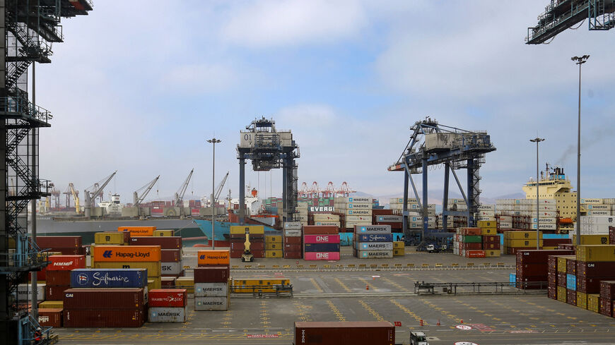 Workers handle containers at APM Terminals in the port of Callao, in Callao, Peru November 19, 2025. REUTERS/Gerardo Marin
