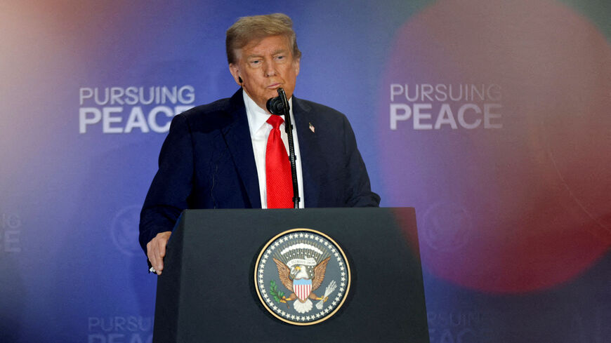 FILE PHOTO: U.S. President Donald Trump holds a press conference with Russian President Vladimir Putin following their meeting to negotiate an end to the war in Ukraine, at Joint Base Elmendorf-Richardson in Anchorage, Alaska, U.S., August 15, 2025. REUTERS/Jeenah Moon/ File Photo