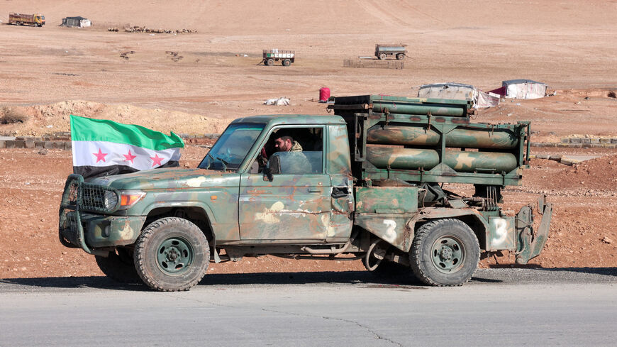 A military vehicle of the Syrian army is parked on the highway near Tabqa, after the Syrian army took control of it, Syria, January 19, 2026. REUTERS/Mahmoud Hassano