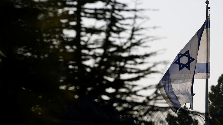 An Israeli flag flies outside the Prime Minister's Office  in Jerusalem, October 22, 2024. REUTERS/Nathan Howard/Pool