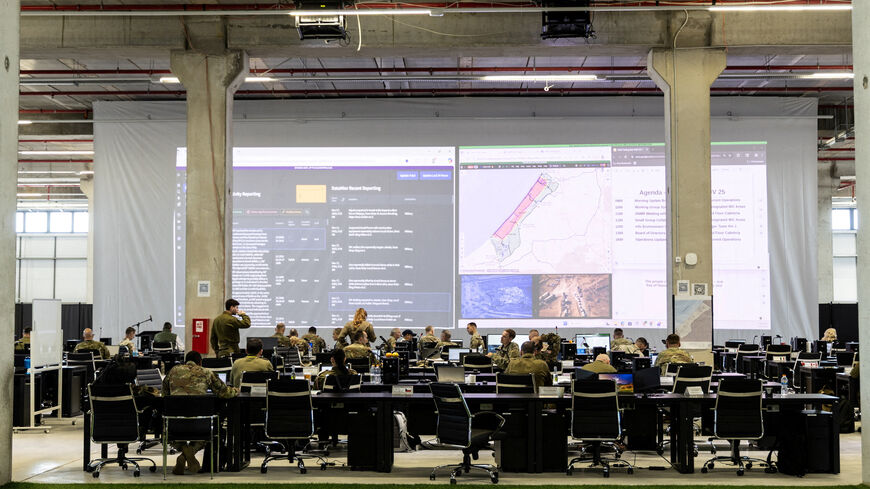 U.S. and Israeli soldiers convene at the Civil Military Coordination Centre, the U.S.-led centre overseeing the implementation of President Donald Trump's plan to end the war in Gaza, in Kiryat Gat, southern Israel November 17, 2025. REUTERS/Alexander Cornwell