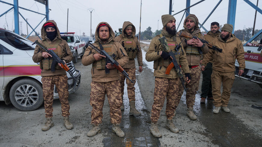 FILE PHOTO: Members of the Syrian military police gather outside al-Aqtan prison, where some Islamic State detainees are held, in Raqqa, Syria January 22, 2026. REUTERS/Karam al-Masri/File Photo