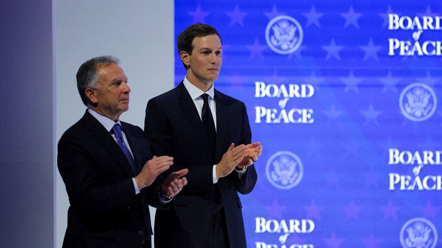 FILE PHOTO: U.S. President Donald Trump's son-in-law, Jared Kushner, and U.S. Special Envoy Steve Witkoff take part in a charter announcement for U.S. President Donald Trump's Board of Peace initiative aimed at resolving global conflicts, alongside the 56th annual World Economic Forum (WEF), in Davos, Switzerland, January 22, 2026. REUTERS/Denis Balibouse/File Photo
