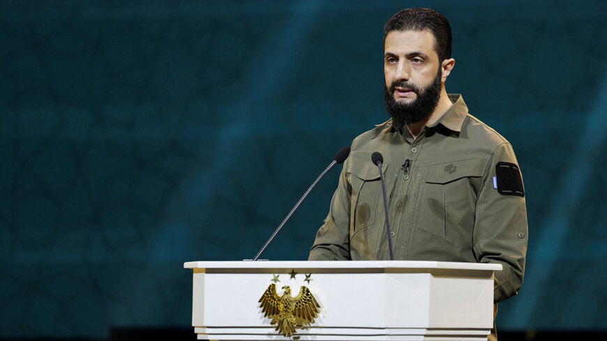FILE PHOTO: Syria's President Ahmed al-Sharaa delivers a speech on the first anniversary of Bashar al-Assad's fall, in Damascus, Syria December 8, 2025. REUTERS/Khalil Ashawi/File Photo
