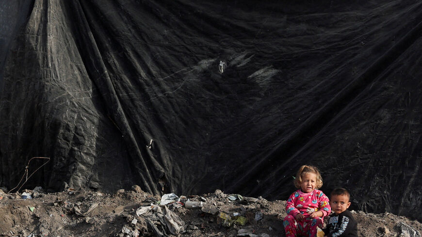 FILE PHOTO: Displaced Palestinian children sheltering at a tent camp, play next to tents, in Gaza City, January 27, 2026. REUTERS/Dawoud Abu Alkas/File Photo