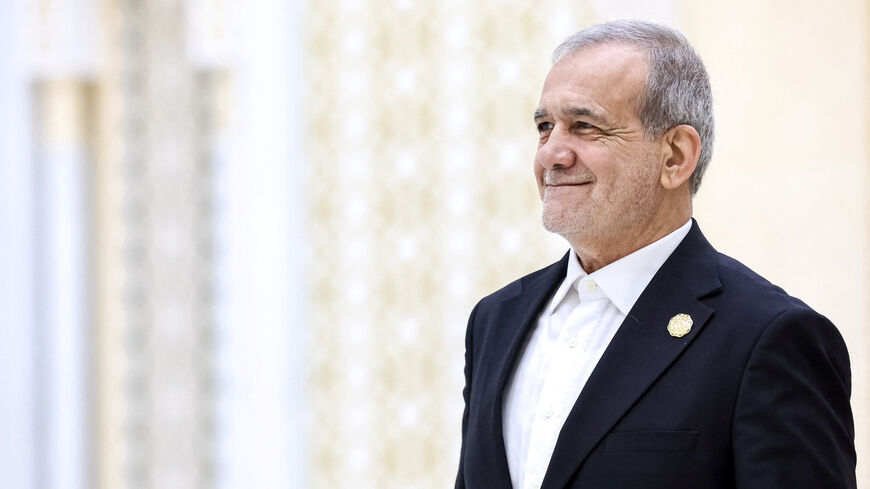 Iranian President Masoud Pezeshkian arrives to attend a plenary session of the International Forum dedicated to the International Year of Peace and Trust, the International Day of Neutrality, and the 30th anniversary of Turkmenistan's neutrality status, at the Congress Centre in Ashgabat, Turkmenistan December 12, 2025. Sputnik/Alexander Kazakov/Pool via REUTERS