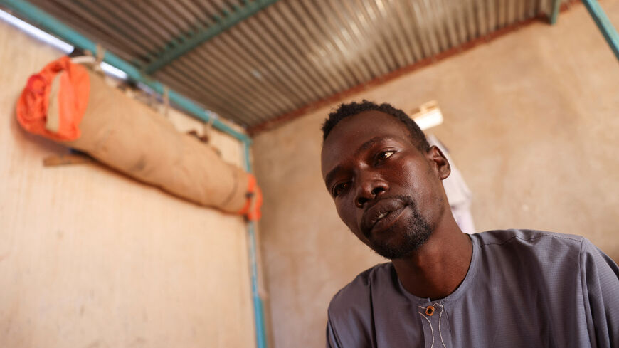 Abdulmajeed Abdulkarim, 28, a Sudanese refugee who heard small children crying at night for their parents while he was held captive by paramilitary Rapid Support Forces (RSF) fighters outside of al-Fashir, during an interview with Reuters in Tine, Chad November 24, 2025. REUTERS/Amr Abdallah Dalsh