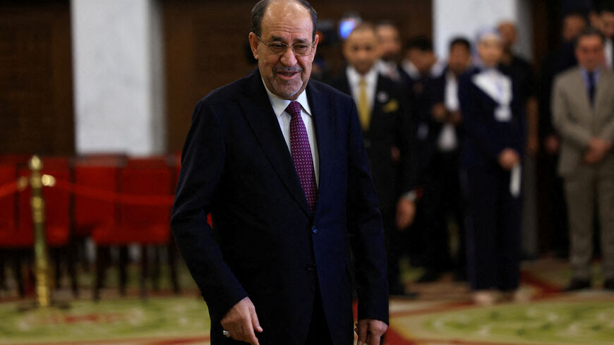 FILE PHOTO: Former Iraqi Prime Minister Nouri al-Maliki walks at a polling station inside Al-Rasheed Hotel during the parliamentary election in Baghdad, Iraq, November 11, 2025. REUTERS/Thaier Al-Sudani/File Photo