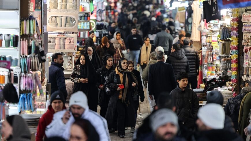 Many shops in the capital Tehran's Grand Bazaar opened again amid a heavy security presence after protests subsided