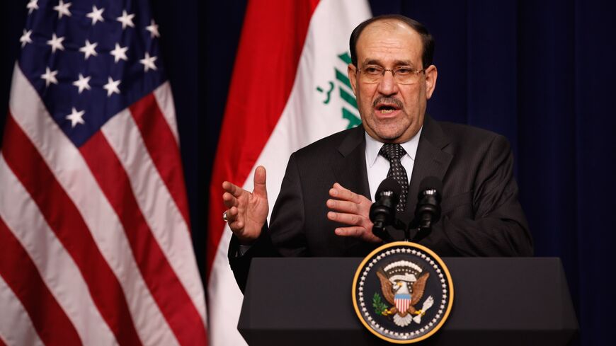 Iraqi Prime Minister Nouri Al-Maliki answers reporters' questions during a news conference with US President Barack Obama in the Eisenhower Executive Office Building on Dec. 12, 2011, in Washington.