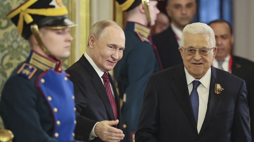 Russia's President Vladimir Putin (L) and Palestinian Authority President Mahmud Abbas (R) arrive for their talks in Moscow on May 10, 2025.