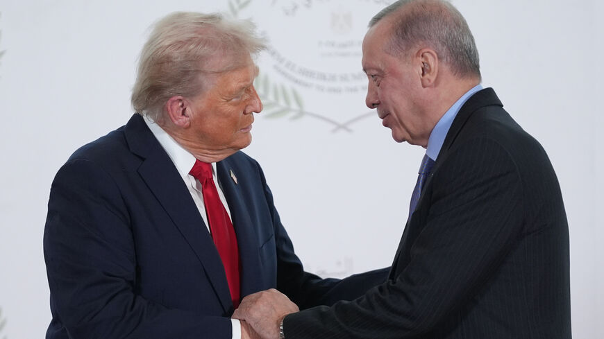 US President Donald Trump greets Turkey's President Recep Tayyip Erdogan during a world leaders' summit on ending the Gaza war on Oct. 13, 2025 in Sharm El-Sheikh, Egypt.  
