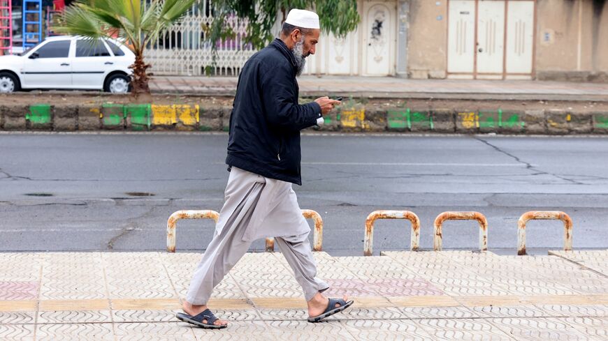 A Baluch Iranian man walks in Zahedan, in the southeastern province of Sistan-Baluchistan, on Dec. 18, 2025. 