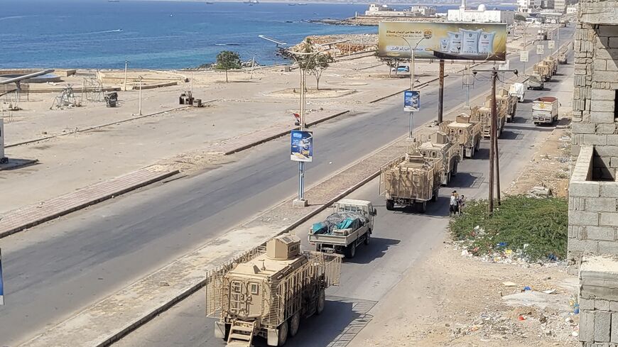 A convoy of armored vehicles makes its way along a street in the port city Mukalla, southern Yemen, on Jan. 1, 2026.