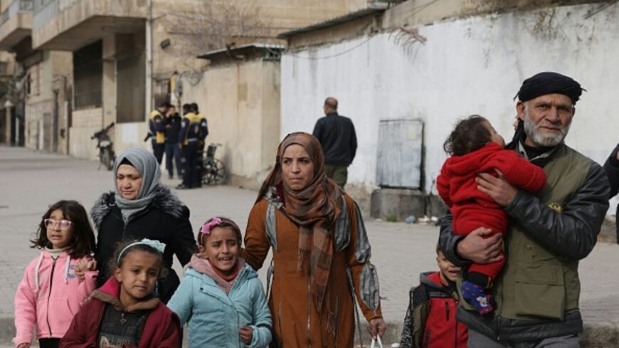 Residents flee from the predominantly Kurdish neighborhoods of Sheikh Maqsud and Ashrafiyeh in Aleppo, northern Syria on January 8, 2026, amid intense clashes between government forces and the Kurdish Syrian Democratic Forces. (Bakr ALkasem / AFP via Getty Images)