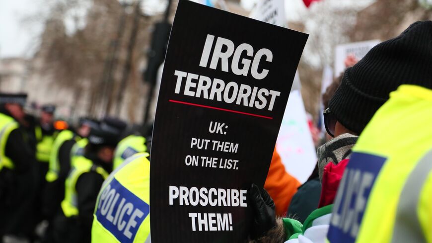 A person holds up a placard which reads "IRGC Terrorist" as they take part in a rally in solidarity with protesters in Iran on Jan. 11, 2026, in London, England. 