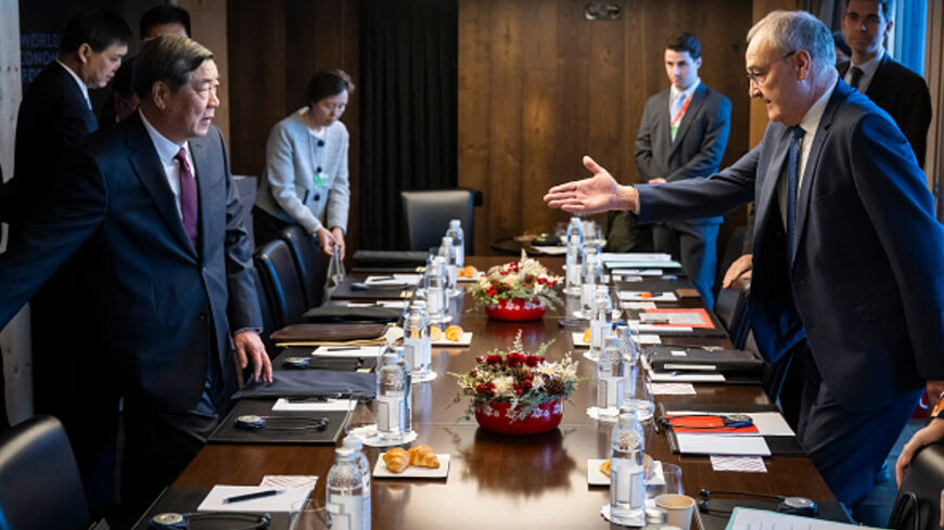 Switzerland's president, Guy Parmelin (R), welcomes China's vice premier, He Lifeng (L), before a bilateral meeting on the sidelines of the World Economic Forum annual meeting in Davos on Jan. 20, 2026. (Laurent  Gillieron/AFP via Getty Images)