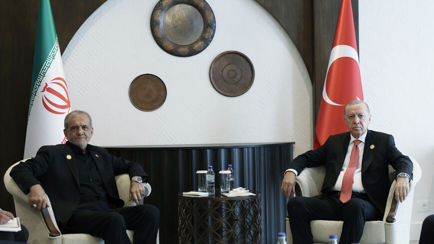 Turkish President Recep Tayyip Erdogan meets with Iranian President Masoud Pezeshkian as they attend the 17th Summit of the Economic Cooperation Organization in Khankendi, Azerbaijan on July 4, 2025.