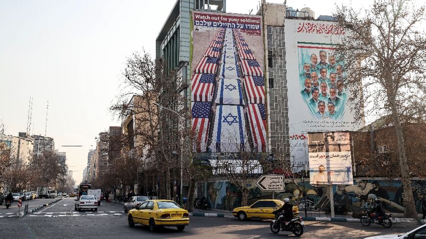 An anti-US and anti-Israel banner is displayed in Iran, which has warned against American military intervention over a deadly crackdown on protests